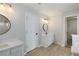 Bright bathroom with dual vanity sinks, and modern light fixtures at 1196 Yellow River Dr, Lawrenceville, GA 30043