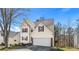 Lovely home with a two-car garage, green lawn and mature trees at 1196 Yellow River Dr, Lawrenceville, GA 30043