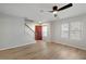 Bright, open living room with hardwood floors and staircase at 1196 Yellow River Dr, Lawrenceville, GA 30043
