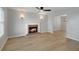 Open living room with cozy fireplace, modern flooring and natural light at 1196 Yellow River Dr, Lawrenceville, GA 30043