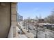A view from the balcony shows a lively street and the city's skyline at 1820 Peachtree Nw St # 303, Atlanta, GA 30309