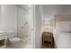 Bathroom with tiled shower, commode, and vanity adjacent to the bed at 1820 Peachtree Nw St # 303, Atlanta, GA 30309