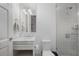 Elegant bathroom showcasing a modern vanity, fixtures, toilet, and tiled shower at 1820 Peachtree Nw St # 303, Atlanta, GA 30309