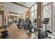 Well-equipped gym with modern exercise machines and large windows providing ample light at 1820 Peachtree Nw St # 303, Atlanta, GA 30309