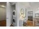 Efficient laundry room features a stacked washer and dryer next to the kitchen at 1820 Peachtree Nw St # 303, Atlanta, GA 30309