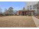This large lawn with building features decorative columns, covered awning, and walkway at 1820 Peachtree Nw St # 303, Atlanta, GA 30309
