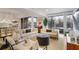 Bright living room featuring neutral tones, large windows, and modern furnishings at 1820 Peachtree Nw St # 303, Atlanta, GA 30309