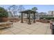 Outdoor seating includes a covered pergola with grill and pool in background at 1820 Peachtree Nw St # 303, Atlanta, GA 30309