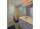 A bright bathroom has a single sink at 257 Brookview Dr, Riverdale, GA 30274