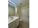 A bright bathroom has a tub and single sink at 257 Brookview Dr, Riverdale, GA 30274