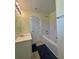 A bathroom has a tub with a shower and single sink at 257 Brookview Dr, Riverdale, GA 30274