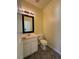 Half bathroom with tiled flooring and modern fixtures at 257 Brookview Dr, Riverdale, GA 30274