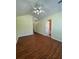 This bedroom has wood floors and a ceiling fan at 257 Brookview Dr, Riverdale, GA 30274