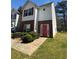 Charming two-story home with red brick accents and a well-manicured front yard at 257 Brookview Dr, Riverdale, GA 30274