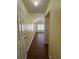 A long hallway leads to a bedroom with fan at 257 Brookview Dr, Riverdale, GA 30274
