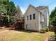 Exterior shot showcasing home's backyard, wooden deck, and well-maintained lawn at 507 Autumn Walk, Canton, GA 30114