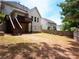 Spacious backyard featuring a wooden deck with stairs, a lawn, and partial fencing at 507 Autumn Walk, Canton, GA 30114