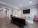 Finished basement features wood floors, seating, an entertainment area, and access to other rooms at 507 Autumn Walk, Canton, GA 30114