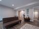Finished basement features wood floors, seating, and an open floor plan at 507 Autumn Walk, Canton, GA 30114