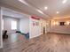 Basement area with neutral walls, multiple rooms, wood floors, and entertainment space at 507 Autumn Walk, Canton, GA 30114