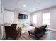 Cozy finished basement features a TV, sofa, and playroom for an entertainment or Gathering room at 507 Autumn Walk, Canton, GA 30114