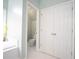 Well-lit bathroom with a toilet, bathtub and closet at 507 Autumn Walk, Canton, GA 30114