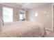 Neutral bedroom features a bed with floral bedding, a window, and interior decor at 507 Autumn Walk, Canton, GA 30114