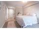 Neutral bedroom features a bed with floral bedding, and interior decor with carpet flooring at 507 Autumn Walk, Canton, GA 30114