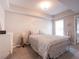 Bright bedroom features a bed with floral bedding, a window, and recessed ceilings at 507 Autumn Walk, Canton, GA 30114