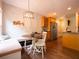 Cozy breakfast nook with stylish chandelier, built-in seating, and view to the kitchen at 507 Autumn Walk, Canton, GA 30114