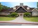 Clubhouse exterior featuring stone accents, ample windows, and professional landscaping at 507 Autumn Walk, Canton, GA 30114