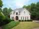 Exterior of a house with a landscaped yard, and traditional architectural features at 507 Autumn Walk, Canton, GA 30114