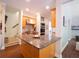 The kitchen island features granite countertops and stainless steel appliances at 507 Autumn Walk, Canton, GA 30114