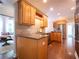 Bright kitchen with stainless steel appliances and natural wood cabinetry at 507 Autumn Walk, Canton, GA 30114