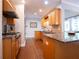 The kitchen is equipped with a stainless range and has a tile backsplash at 507 Autumn Walk, Canton, GA 30114