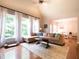 Spacious living room with large windows, hardwood floors, and a comfortable sectional sofa at 507 Autumn Walk, Canton, GA 30114