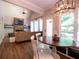 Open-concept living room with stone fireplace, high ceilings, and abundant natural light at 507 Autumn Walk, Canton, GA 30114