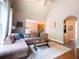 Comfortable living room with hardwood floors, a sectional sofa, and an open layout at 507 Autumn Walk, Canton, GA 30114