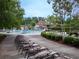 Beautiful community pool with multiple lounge chairs, landscaping, and mature trees at 507 Autumn Walk, Canton, GA 30114
