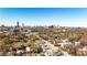Expansive aerial view showcases the vibrant city skyline and surrounding neighborhoods on a clear, sunny day at 976 Blue Ridge Ne Ave, Atlanta, GA 30306