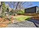 Lush backyard with mature trees, seating, storage shed, and play area provides a private outdoor oasis at 976 Blue Ridge Ne Ave, Atlanta, GA 30306