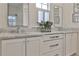 Bathroom with a white vanity with double sinks, marble countertop, tiled floors, and elegant fixtures at 976 Blue Ridge Ne Ave, Atlanta, GA 30306