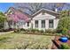 Charming cottage-style home with manicured lawn and colorful potted plants at 976 Blue Ridge Ne Ave, Atlanta, GA 30306