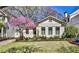 Charming cottage-style home featuring manicured lawn and vibrant landscaping at 976 Blue Ridge Ne Ave, Atlanta, GA 30306