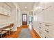 Entryway hallway with desk space, hardwood floors, built-in storage cabinets, and a view to the living room at 976 Blue Ridge Ne Ave, Atlanta, GA 30306