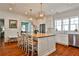 Bright, airy kitchen with white cabinets, stainless steel appliances, and large center island at 976 Blue Ridge Ne Ave, Atlanta, GA 30306