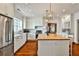 Bright, airy kitchen with white cabinets, stainless steel appliances, and large center island at 976 Blue Ridge Ne Ave, Atlanta, GA 30306