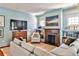 Cozy living room with fireplace, built-in shelves, and hardwood floors at 976 Blue Ridge Ne Ave, Atlanta, GA 30306