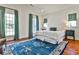 Main bedroom features a decorative rug, hardwood floors, lots of natural light, and elegant furnishings at 976 Blue Ridge Ne Ave, Atlanta, GA 30306