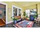 Bright sunroom with large windows, slate floors, and stylish decor at 976 Blue Ridge Ne Ave, Atlanta, GA 30306